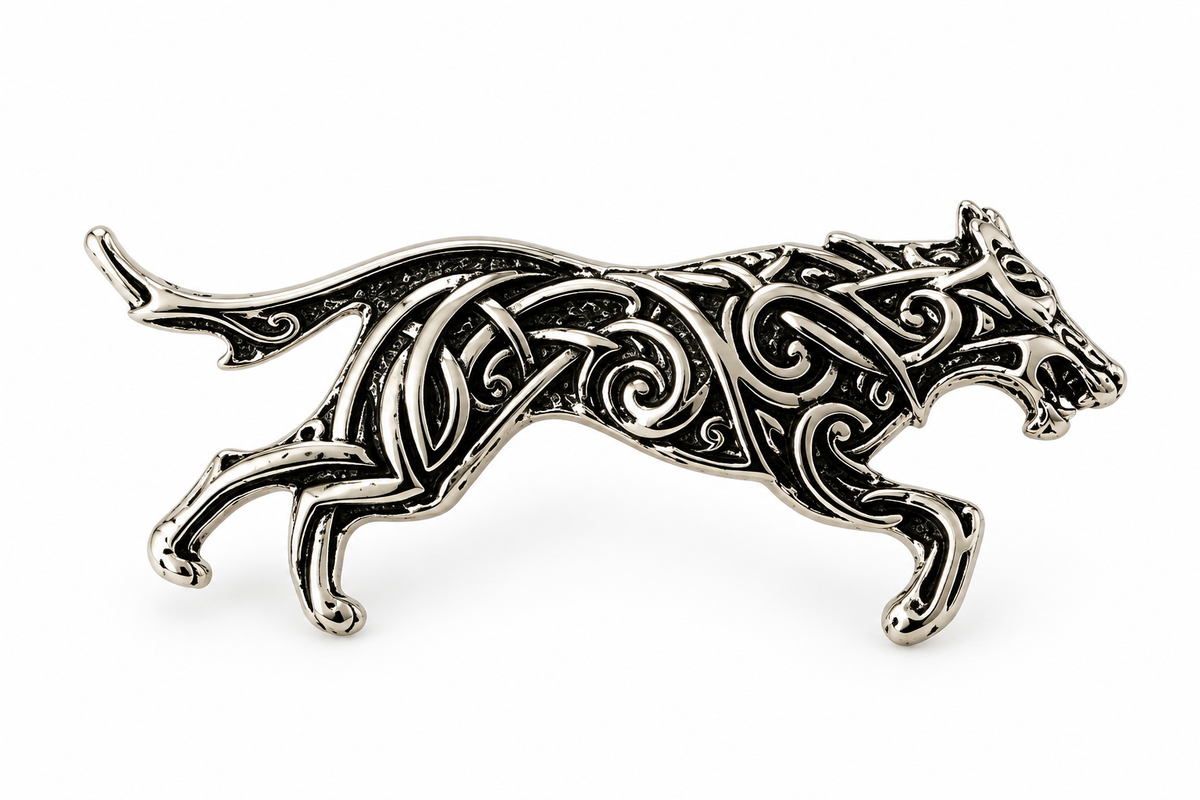 Antique silver-tone leaping cat brooch on white background