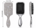 Silver rhinestone paddle hair brush with black cushioned bristles, 21.5 cm long